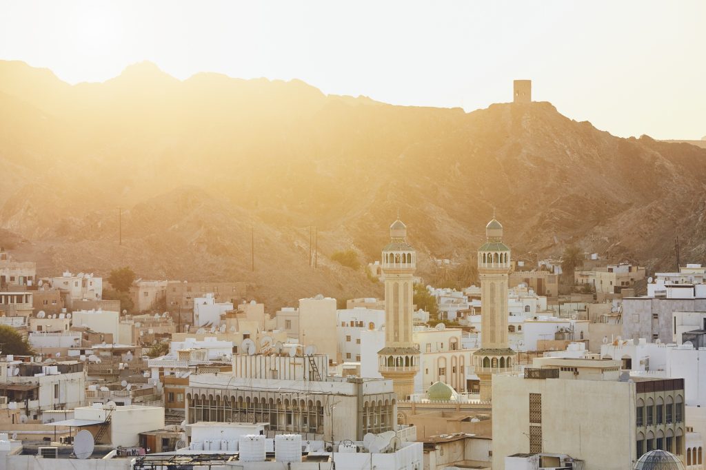 Cityscape view of Muscat city at sunset. The capital of Oman.